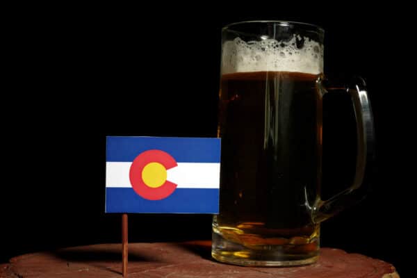 Colorado flag with beer mug isolated on black background
